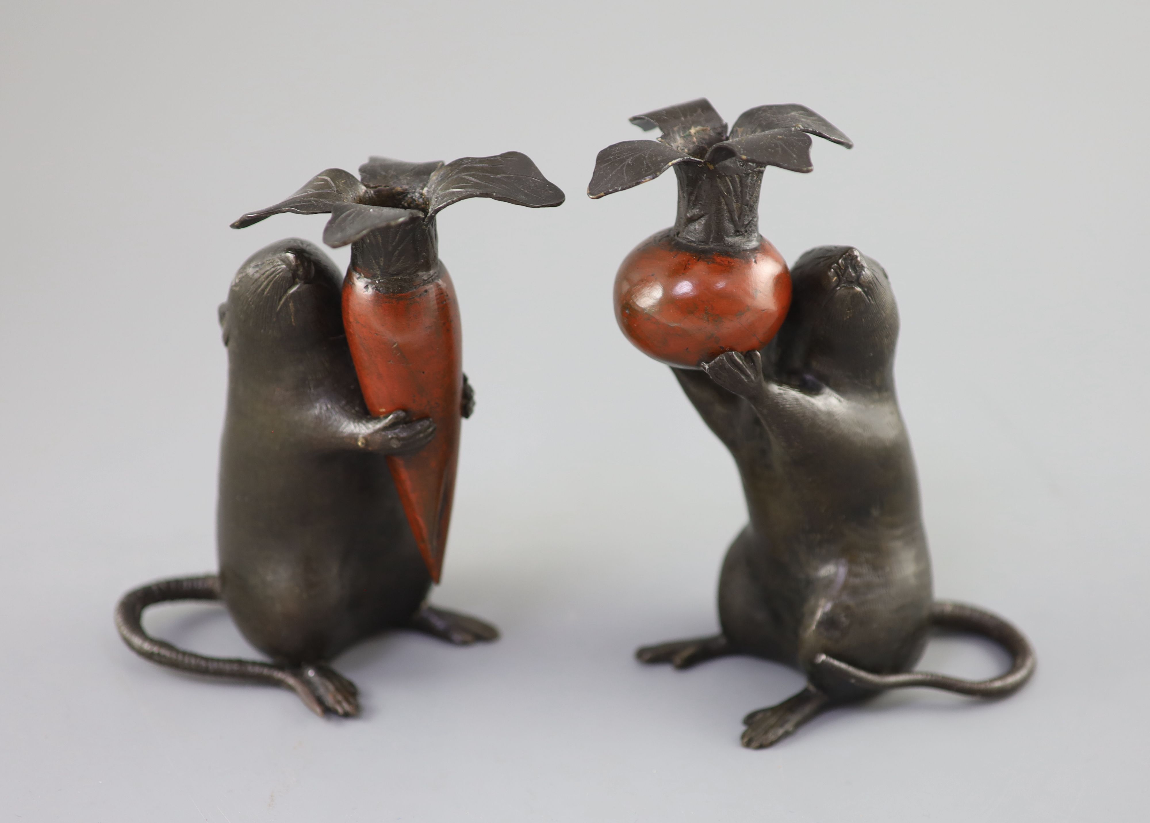 A pair of Japanese bronze rat candlesticks, Meiji period, 16cm and 17cm high